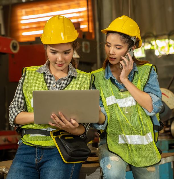 Site workers checking a booking on a tablet