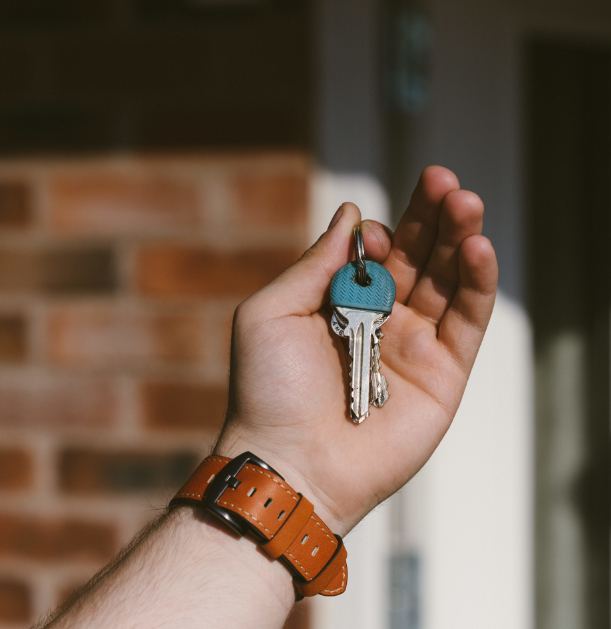 A landlord handing over the keys to a property