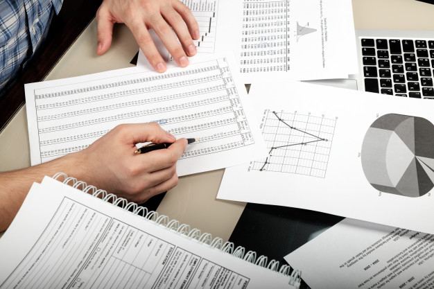 Compliance paperwork and certificates on a desk
